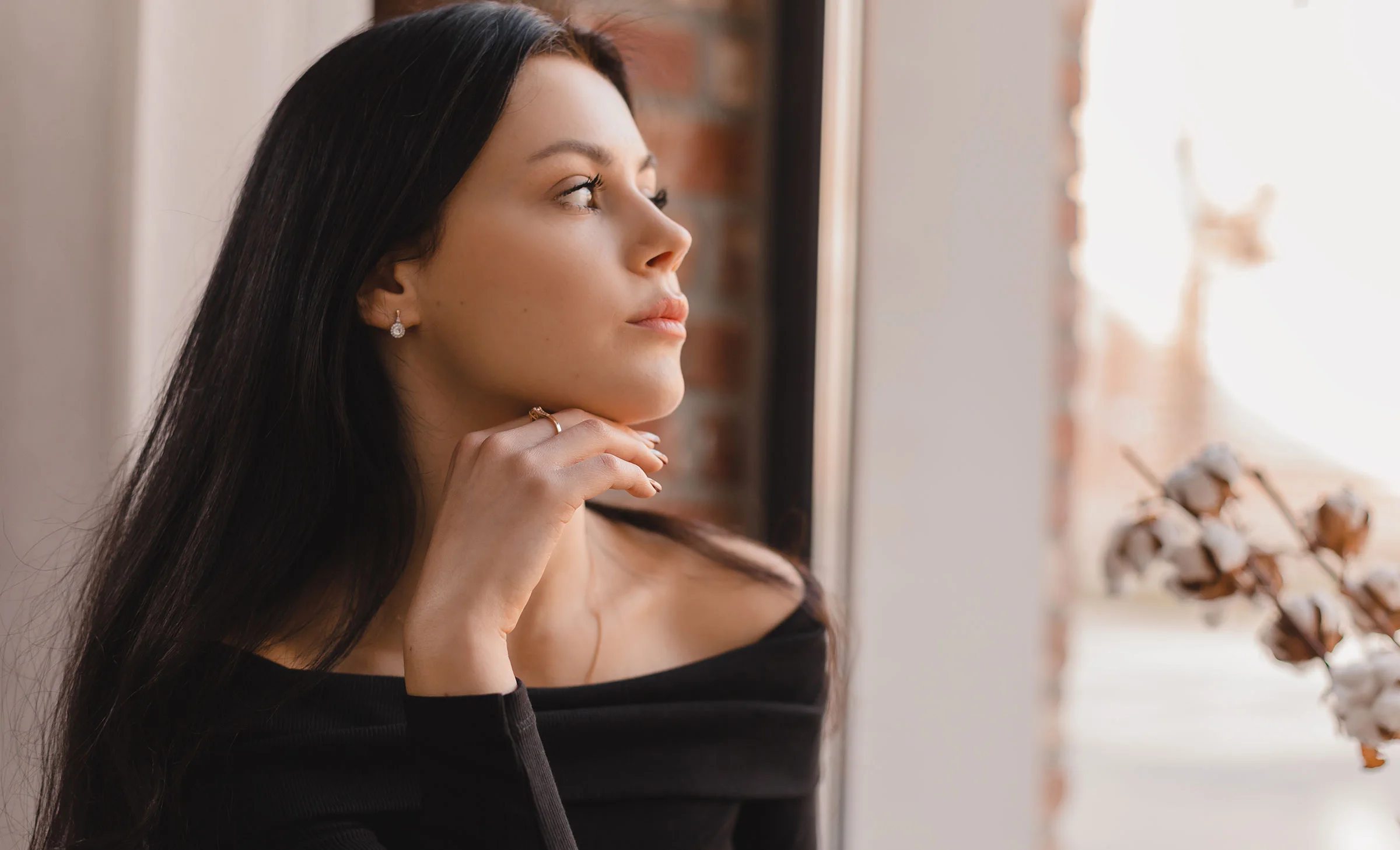 Profile of woman's face looking out window