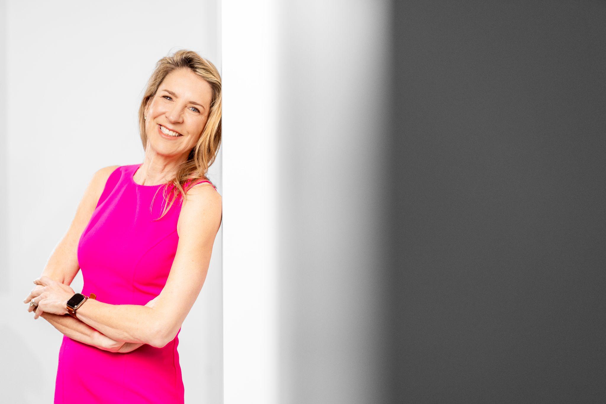 Plastic surgeon in clinic offering guidance on replacing breast implants